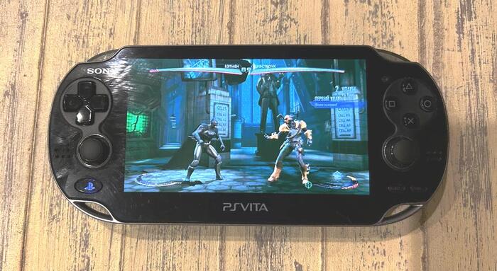  "Injustice! Gods among us"  PS3  PS Vita.     .